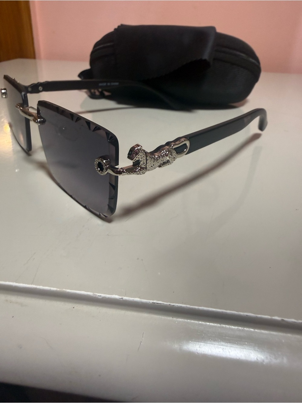 Black Rimless Sunglasses with Silver Snake Accent
